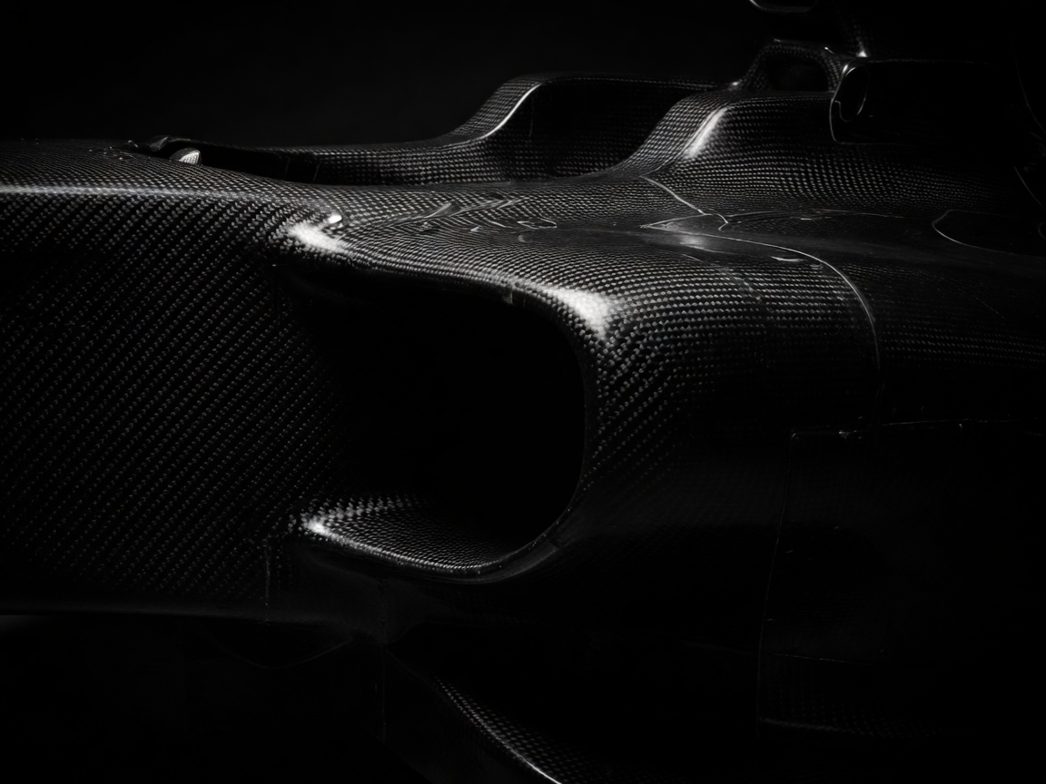 High contrast black and white view of carbon composite monocoque chassis edge